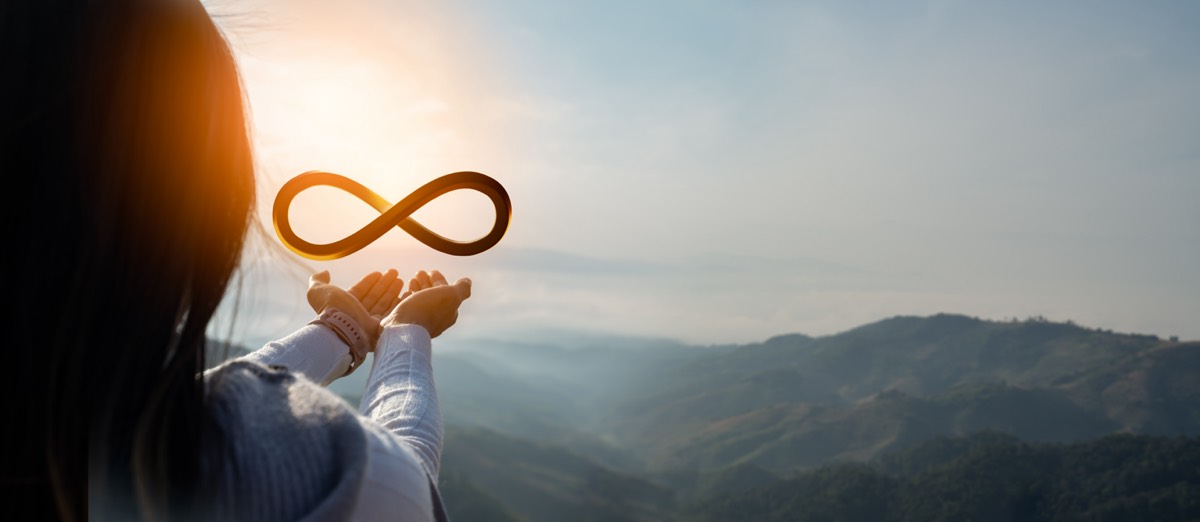 Sustainable strategy approach to eliminate waste and pollution for future growth of business and environment,reuse and renewable material resources concept.Businessman hold infinity circular economy